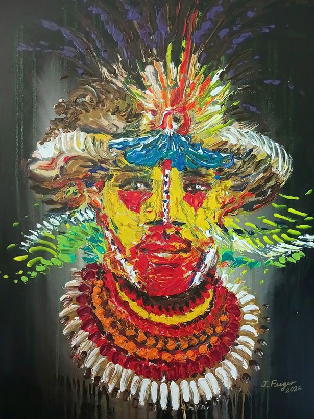 Vivid yellow and red painted face crowned with a burst of feathers and a shell collar, on a dark ground.